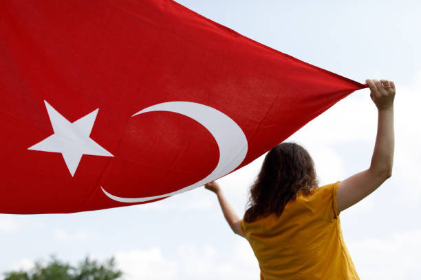 istock Young woman holding turkish flag 1185499401
