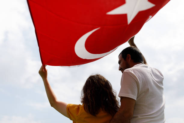 istock Young Turkish Couple And The Turkish Flag 1185499489