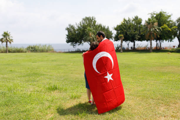 istock Young Turkish Couple And The Turkish Flag 1185499565