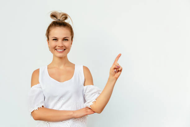 istock Funny girl showing empty copy space 1185500793