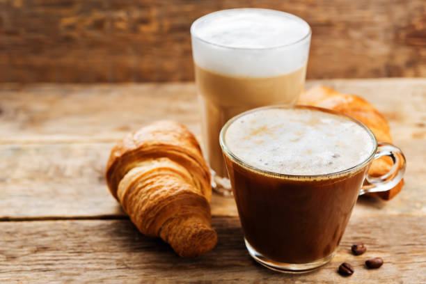 istock Coffee drink with fresh croissants and coffee beans 1185501929