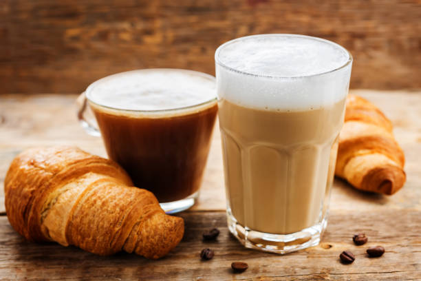 istock Coffee drink with fresh croissants and coffee beans 1185501932