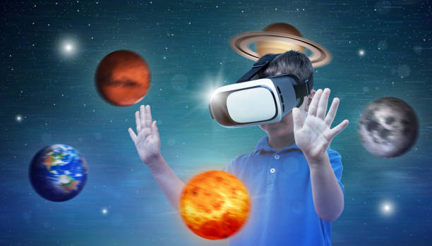 istock Planets revolve around boy with virtual reality glasses. Concept of using modern technologies for learning and fun. 1185502073