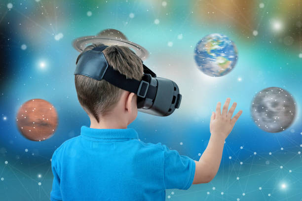 istock Boy with virtual reality glasses rotate planets concept. Fun and learning with apps and virtual reality devices. 1185502078