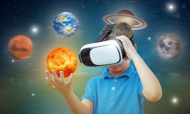 istock Boy studies space with the help of technology and the app. Virtual reality headset. 1185502083