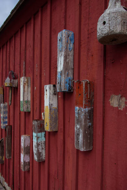 istock Red boat house wall in Rockport harbor 1185502795