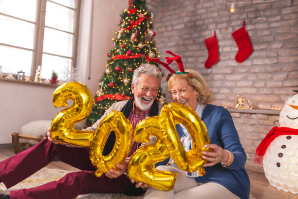 istock Senior couple holding 2020 balloons 1185502887