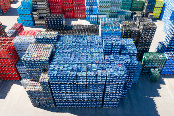 Stacks of Beverage Bottle Crates, Aerial View Bottling plant and distribution warehouse of various drinks. beer crate stock pictures, royalty-free photos & images