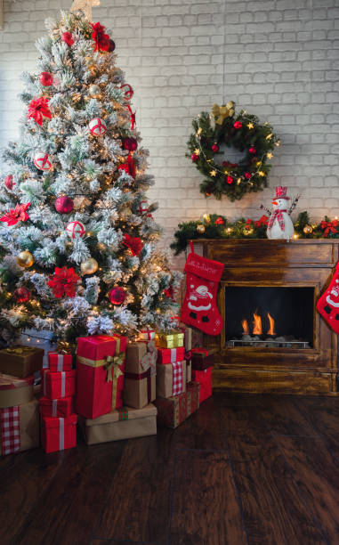 istock Decorated Christmas Tree Near Fireplace at Home 1185505518