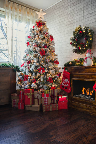 istock Decorated Christmas Tree Near Fireplace at Home 1185505632
