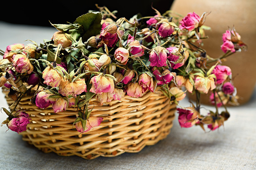 Basket with dried roses.