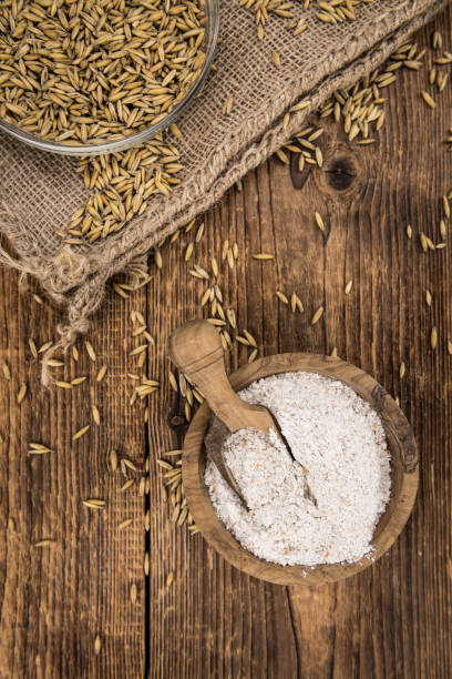 istock Wooden table with Oat Flour (detailed close-up shot; selective focus) 1185507331