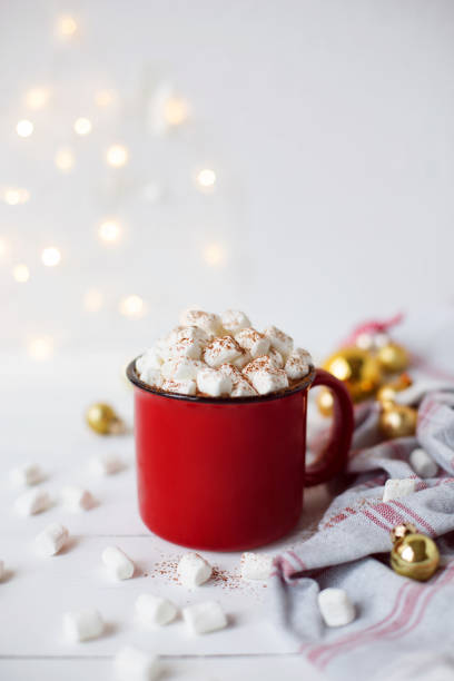istock Cup of hot cocoa or chocolate with marshmallow on white background. Spring and winter concept. Close up. 1185509792