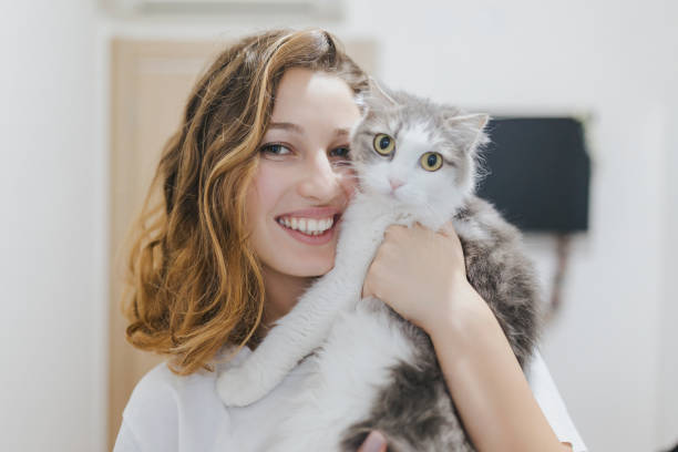 istock Young woman with cat in arms. 1185511411