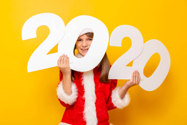 istock Child Santa holding 2020 numbers 1185513279
