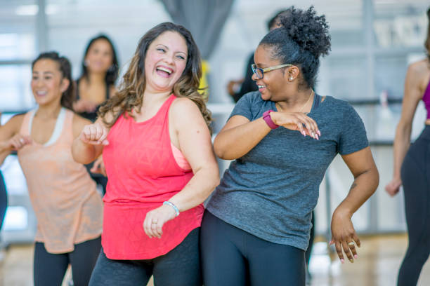 istock Multi-Ethnic Group of Women Dancing in a Zumba Class stock photo 1185513607