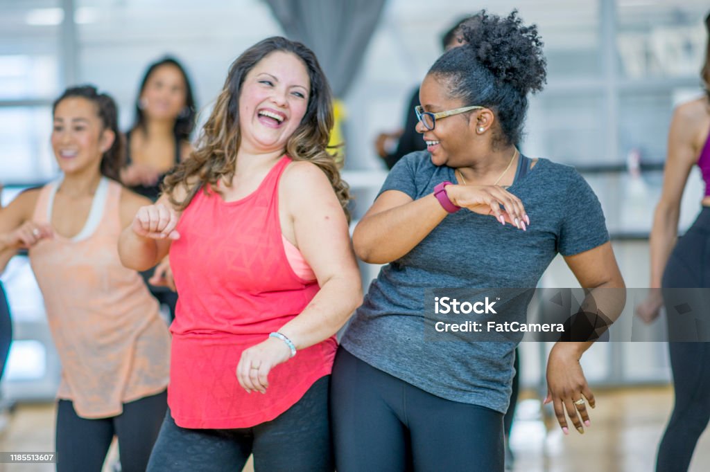 Multiethnic Group Of Women Dancing In A Zumba Class Stock Photo