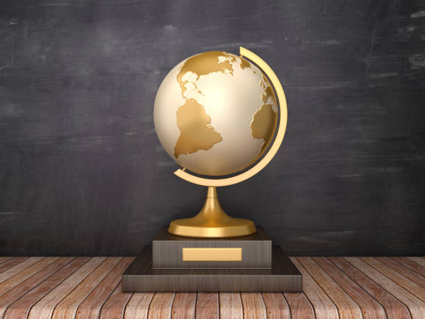 istock Trophy with Desktop Globe on Wood Floor - Chalkboard Background - 3D Rendering 1185514638