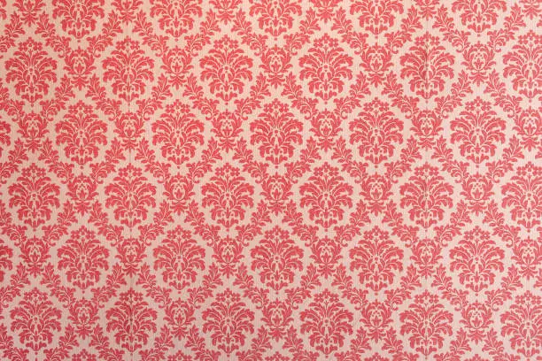 Photo of Red wallpaper vintage flock with red damask design on a white background retro vintage style