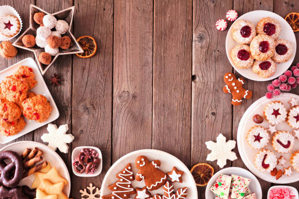 istock Christmas baking, sweets and cookies, top view arched border over a rustic wood background 1185515718