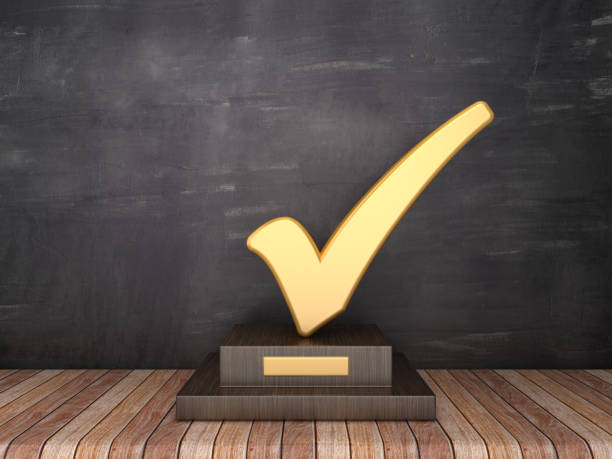 istock Trophy with Check Mark on Wood Floor - Chalkboard Background - 3D Rendering 1185515780