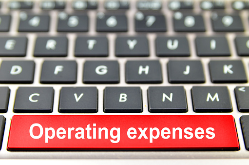 Operating expenses word on computer keyboard, 3D rendering