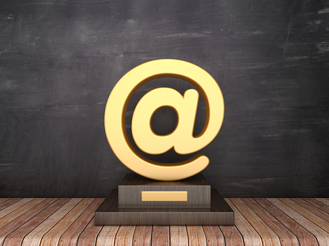 Trophy with Email Symbol on Wood Floor - Chalkboard Background - 3D Rendering