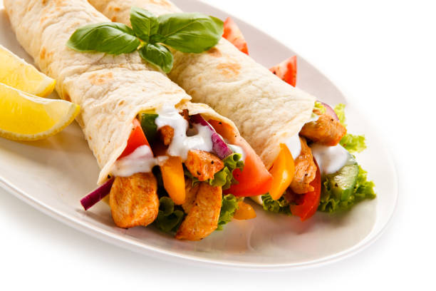 istock Kebab - grilled meat and vegetables on white background 1185519409
