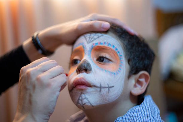 istock Latino boy, making up for Mexican skull 1185519541