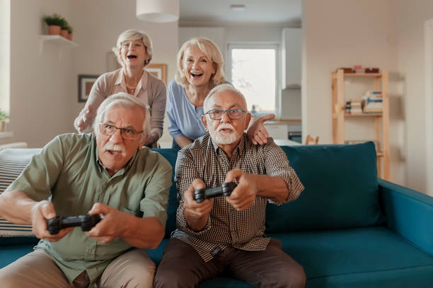 istock Seniors Having a Great Time Together While Playing Video Game 1185519723