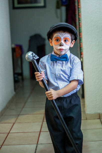 istock Latin child Mexican skull makeup, catrin 1185520308