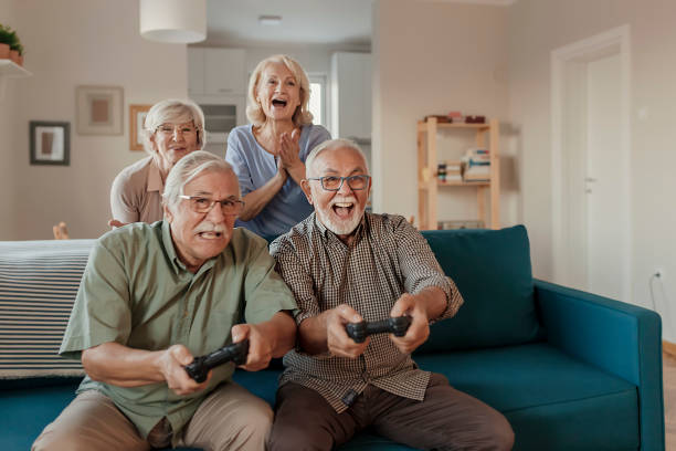 istock Seniors Having a Great Time Together While Playing Video Game 1185520321