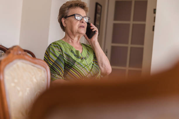 istock Senior woman talking on phone 1185532297
