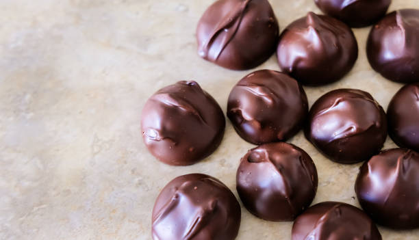 istock Dark chocolate covered macadamia pralines. 1185532400