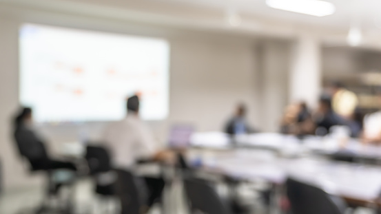 Office meeting blur background with business people working group in boardroom discussion for teamwork brainstorming, executive seminar or professional training in small startup enterprise