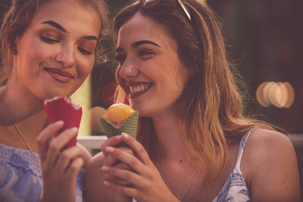 istock Friends tasting delicious ice cream flavors 1185536572