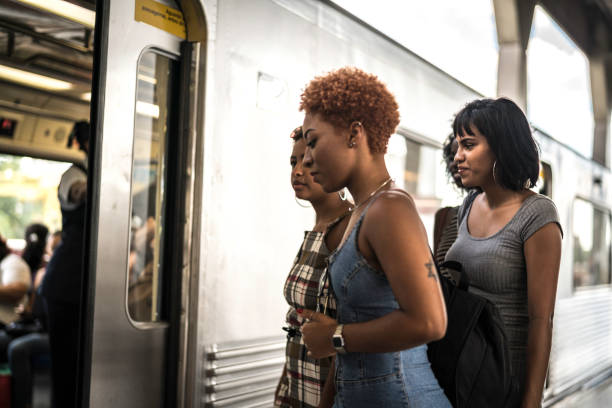 istock Group of women entering a subway train 1185538146