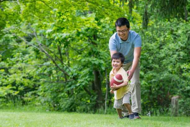 istock Football in the Park 1185539487