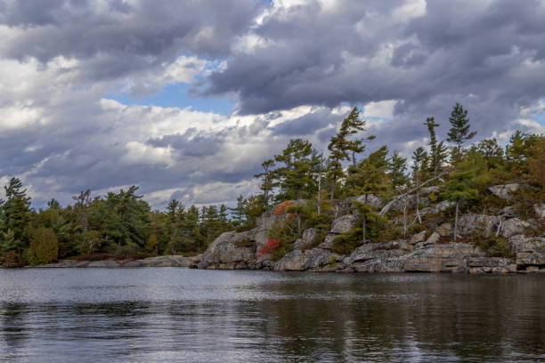 istock cloudy autumn day at the lake 1185541070