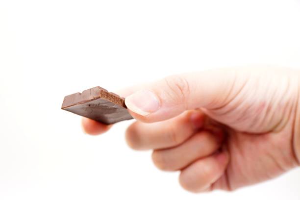 istock Piece of yummy milk chocolate 1185542114