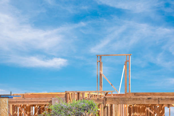 istock Construction workers building a two story residential house 1185542137