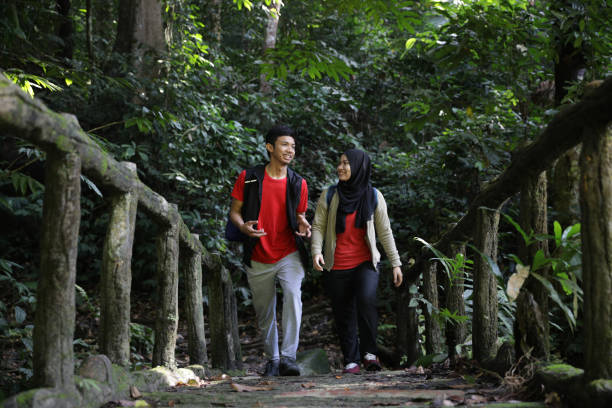 istock Young beautiful couple exploring rainforest 1185549288
