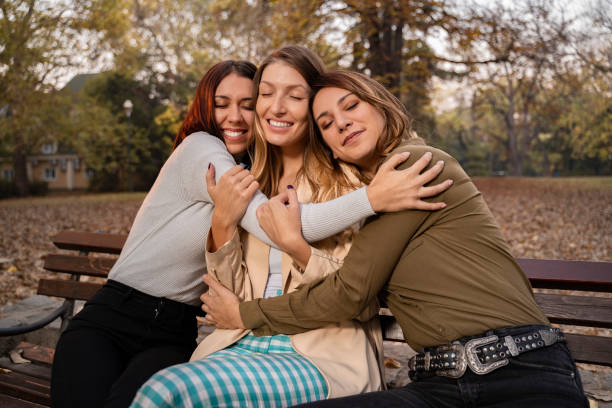 istock Affectionate female friends hugging , eyes closed 1185551652