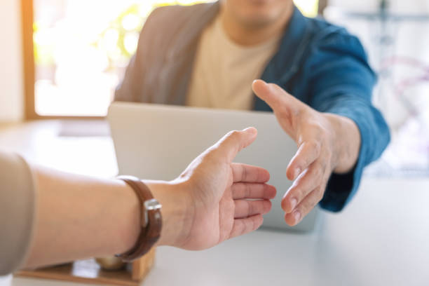 istock Two businessman open hand to shaking 1185551862