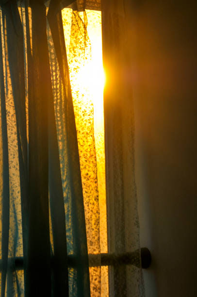 istock Curtain in sunrise background 1185557612