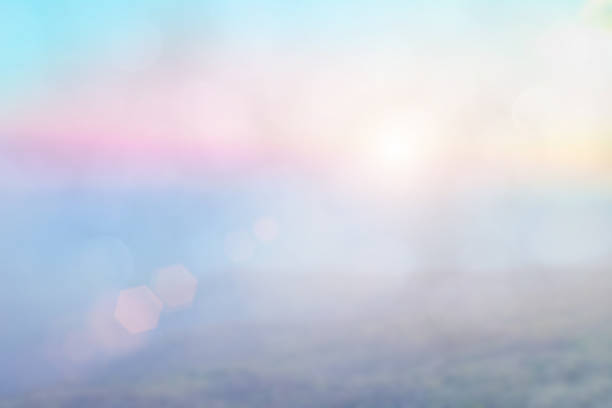 istock Natural background blurring warm colors and bright sun light. Bokeh or Christmas background Green Energy at sky sunny color orange light patterns plain abstract flare evening clouds blur. 1185561091