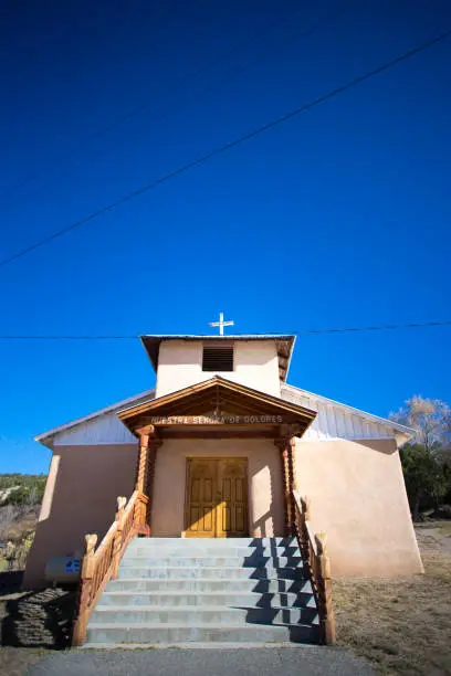 Vadito (Taos County), NM: Nuestra Señora de los Dolores Church with blue sky background and copy space.