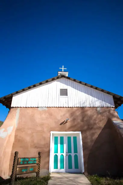 Vadito (Taos County), NM: Nuestra Señora de la Asunción Church with blue sky background and copy space.