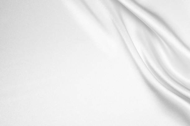 White Silk Wavy Texture Background White Silk Wavy Texture Background. textured silver flowing wave pattern stock pictures, royalty-free photos & images