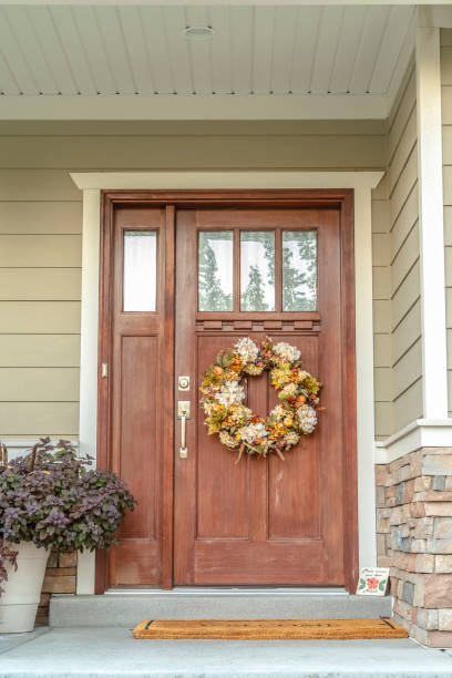 istock Front door with dried flower wreath day 1185572347